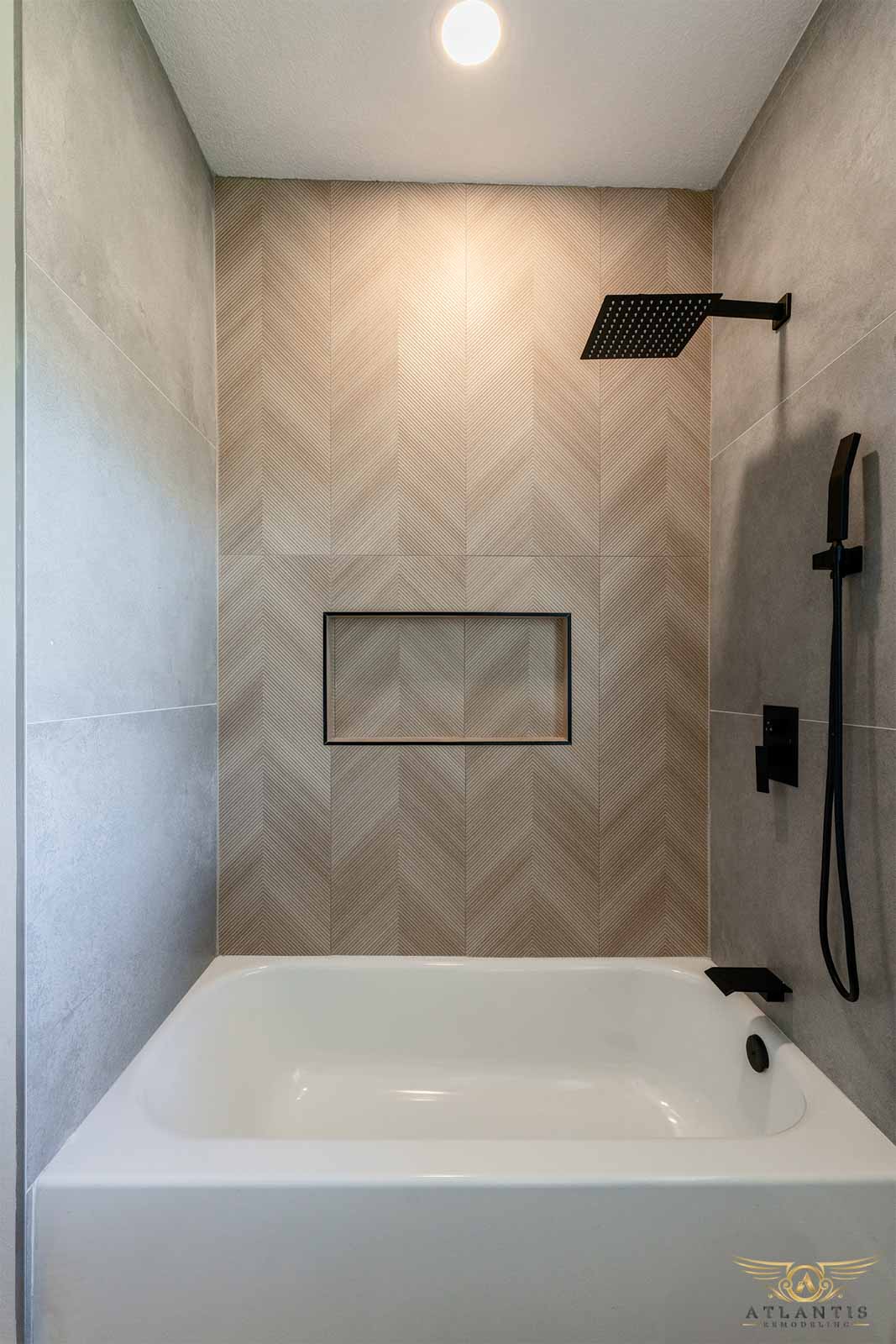 Bathtub shower with herringbone accent wall