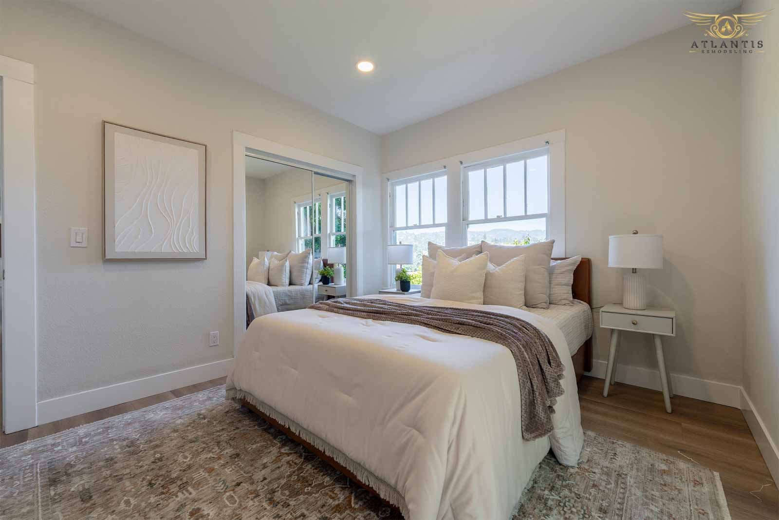 Elegant guest bedroom with mirrored closet doors