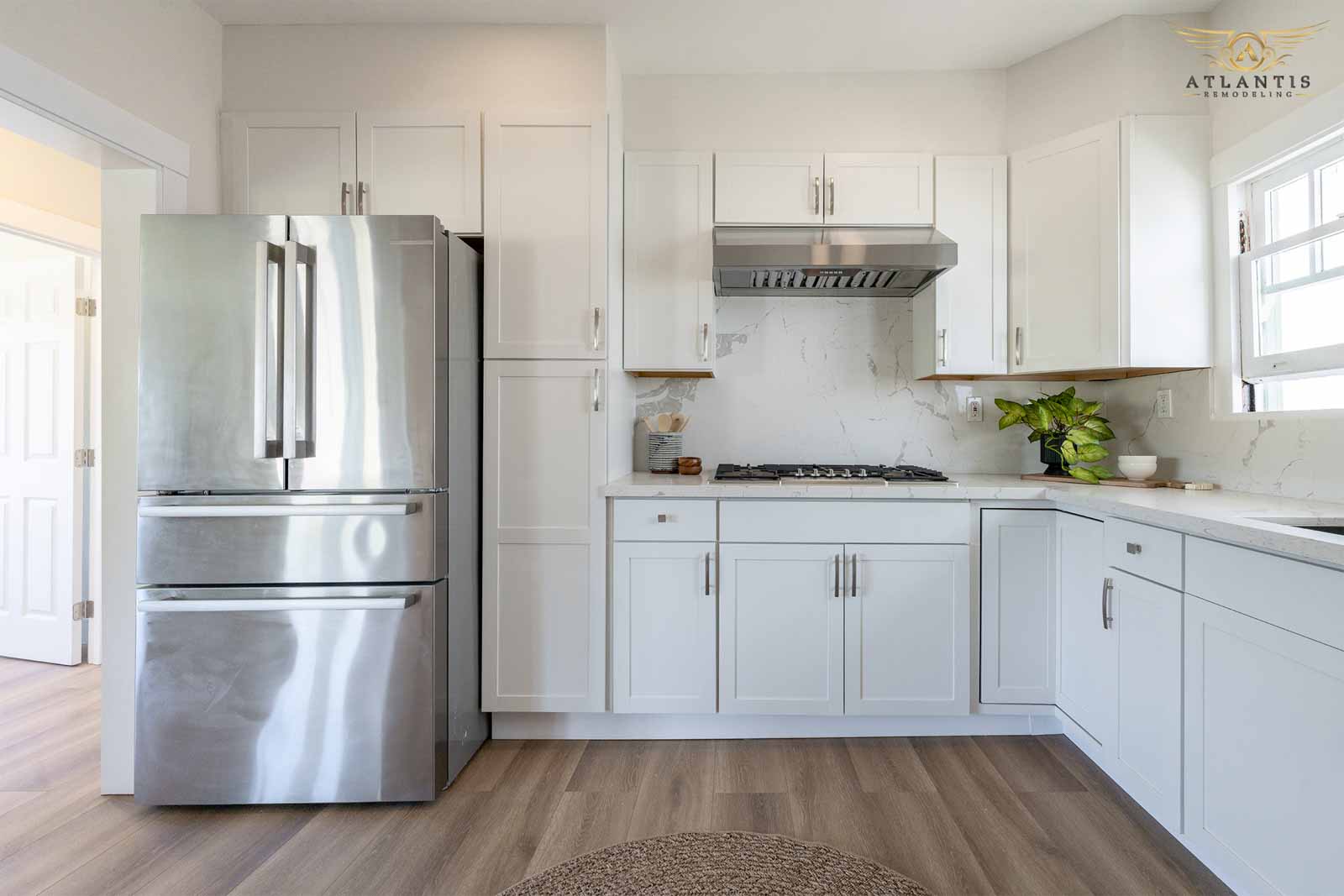 Kitchen with gas cooktop and marble backsplash