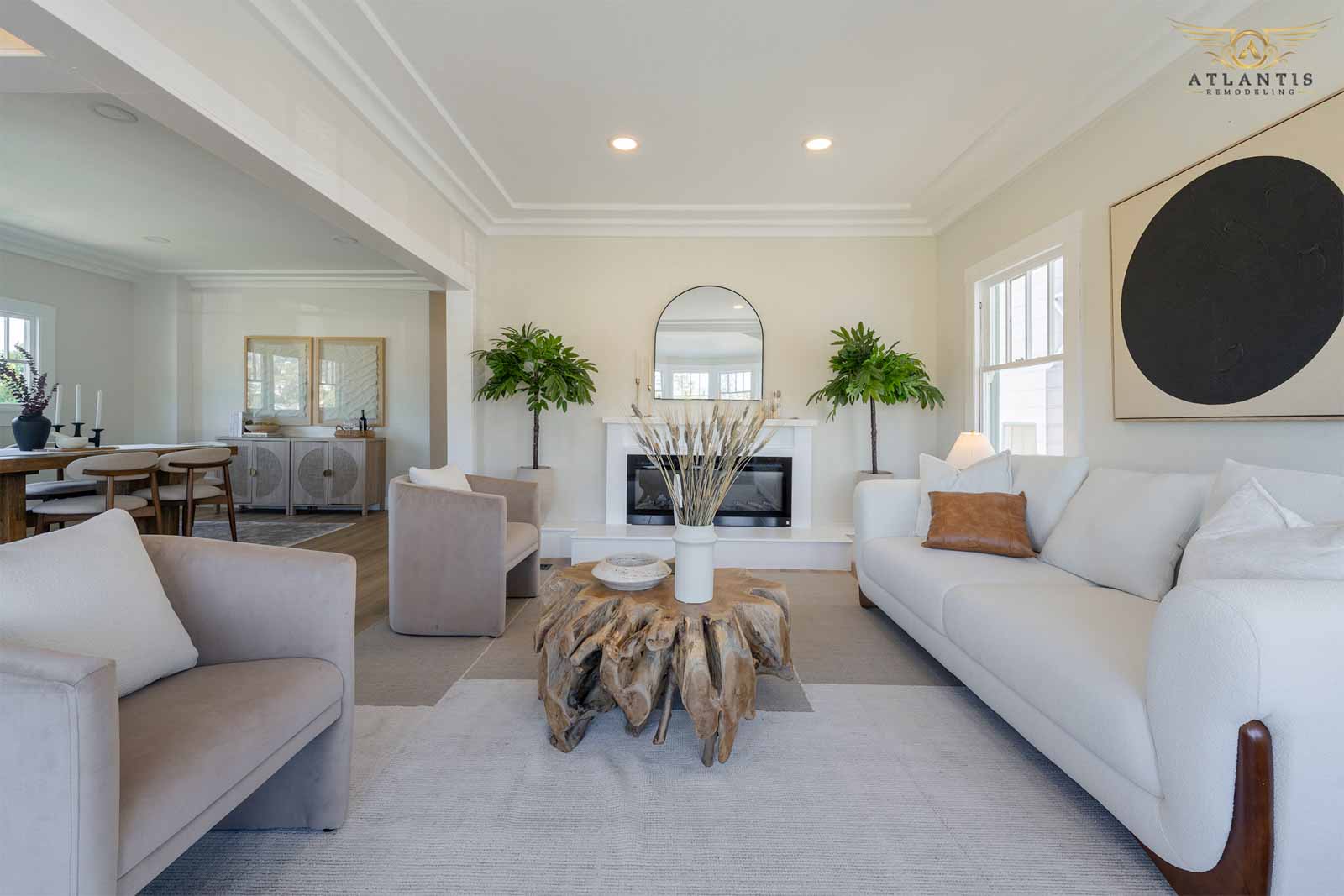 Open-concept living room with fireplace and plants