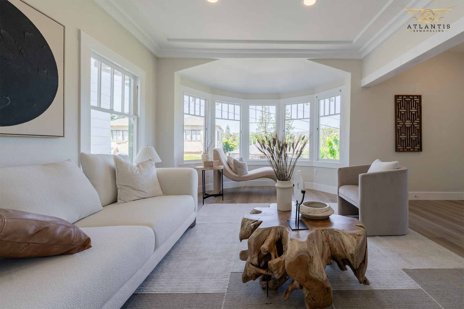 Bright living room with bay window and cream sofa